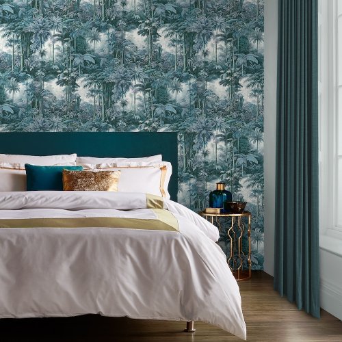 Benmore Ridge Twilight Wallpaper roll shot with deep blue and teal tropical palm leaves