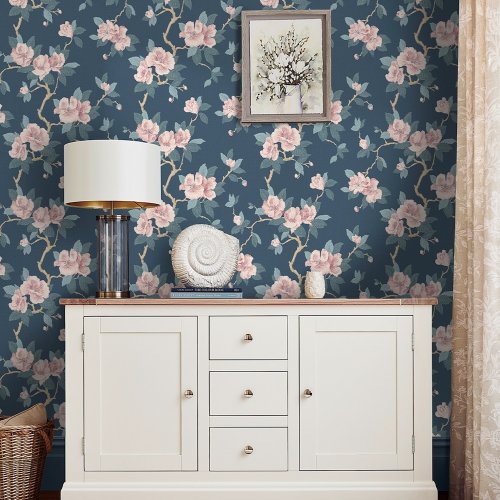 Laura Ashley Maya Dusky Spray Wallpaper in a styled interior, adding classic floral charm.