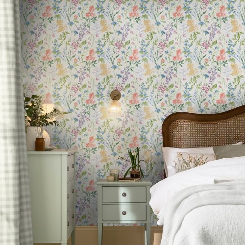 Laura Ashley Elston Garden Multi Wallpaper styled in a bright interior with vibrant watercolour flowers creating a fresh and inviting atmosphere