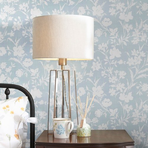 Laura Ashley Rye Pale Seaspray Wallpaper styled in a bedroom, creating a light and elegant atmosphere