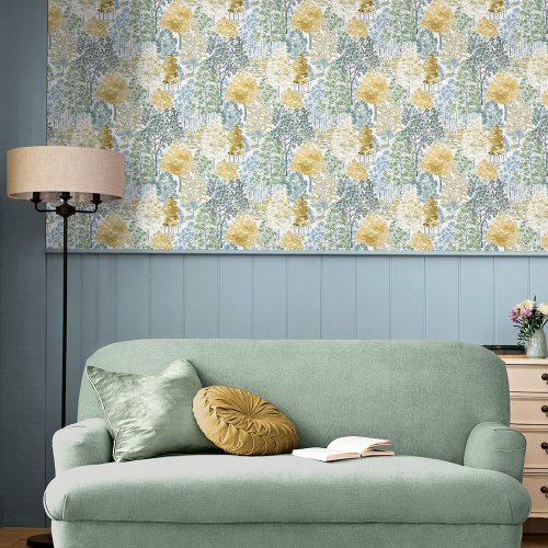 Laura Ashley Bernwood Ochre Yellow Wallpaper styled in an interior setting, bringing a natural woodland theme with warm earthy hues