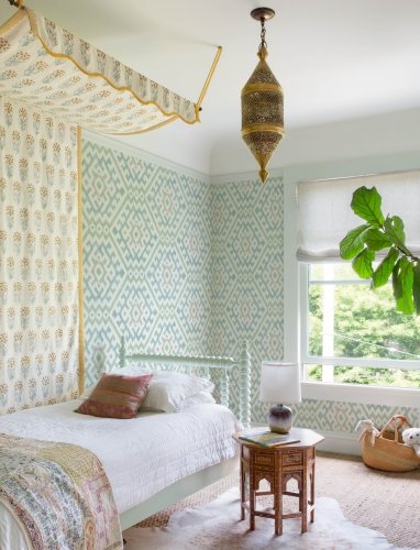 A Street Prints Solola Green and Blue Wallpaper styled in a modern interior, creating a relaxed yet sophisticated atmosphere