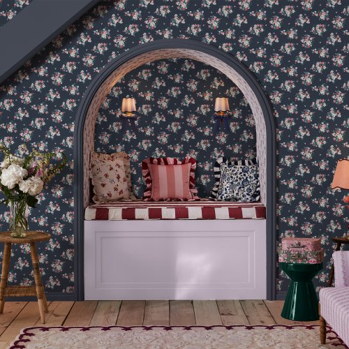 Room decorated with Clifton Floral Navy wallpaper featuring vibrant florals against a navy backdrop