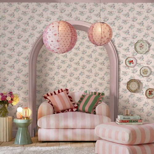 Room decorated with Clifton Floral Pink wallpaper featuring blooming flowers and butterflies