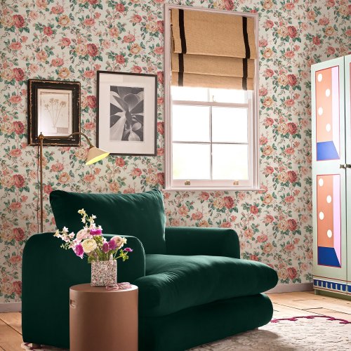 Room decorated with Garden Rose Autumn wallpaper, featuring vintage florals in soft pinks and greens.