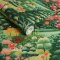 Roll shot of Arley Garden Day Wallpaper with vibrant green hills and blooming floral details