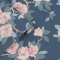 A rolled Laura Ashley Maya Dusky Spray Wallpaper showing its rich floral pattern and elegant texture.