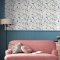 Laura Ashley Litton Dusky Seaspray Wallpaper styled in a room, bringing a fresh and elegant floral touch to the walls.