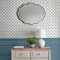 Laura Ashley Westminster Dusky Seaspray Wallpaper styled in an interior, bringing a classic geometric touch to the walls.