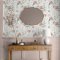 Laura Ashley Pallington Bloom Plaster Pink Wallpaper styled in an interior space, adding a soft, elegant floral touch with its meadow-inspired design