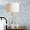 Laura Ashley Rye Pale Seaspray Wallpaper styled in a bedroom, creating a light and elegant atmosphere