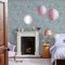 Room decorated with Birds and Roses Summer wallpaper, showcasing vibrant pastel florals and birds against a soft blue backdrop.