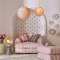 Room decorated with Button Spot Pink wallpaper, featuring playful cream polka dots on a pink backdrop