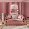 Room decorated with Canopy Stripe Pink & Red wallpaper, featuring striking red and pink stripes