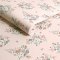 Roll of Clifton Floral Pink wallpaper showcasing a soft floral design