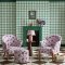 Room decorated with Painted Gingham Pink wallpaper, showcasing a cute pink and white gingham pattern