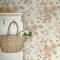 Cream and apricot floral wallpaper with trailing flower patterns