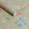 Poppy Meadow wallpaper in soft green with pink and blue flowers.